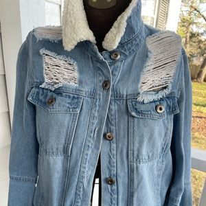 Distressed denim jacket with bell sleeves